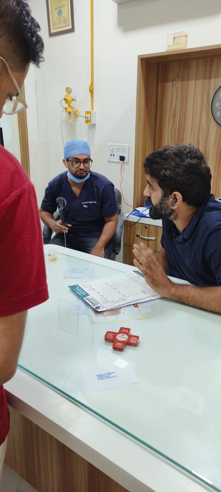 ENT surgeon examining with an endoscope in the OPD